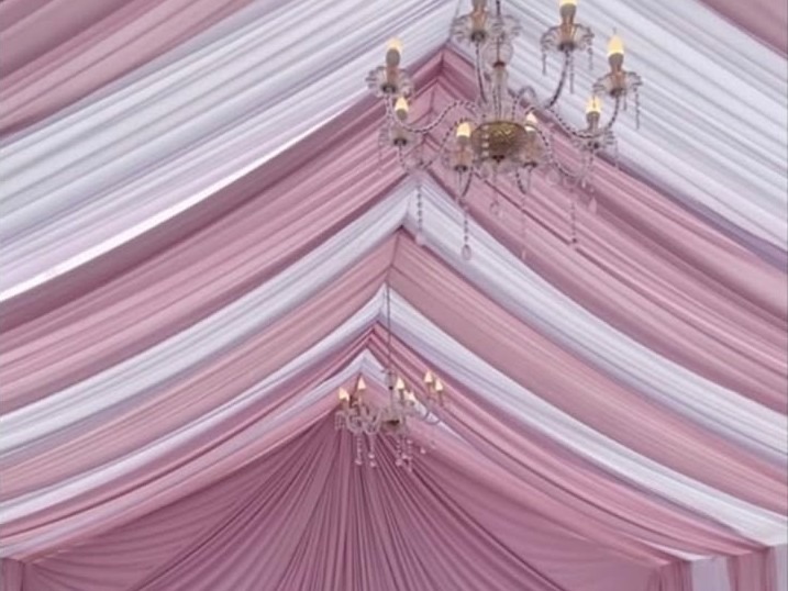 Pink and white draped canopy