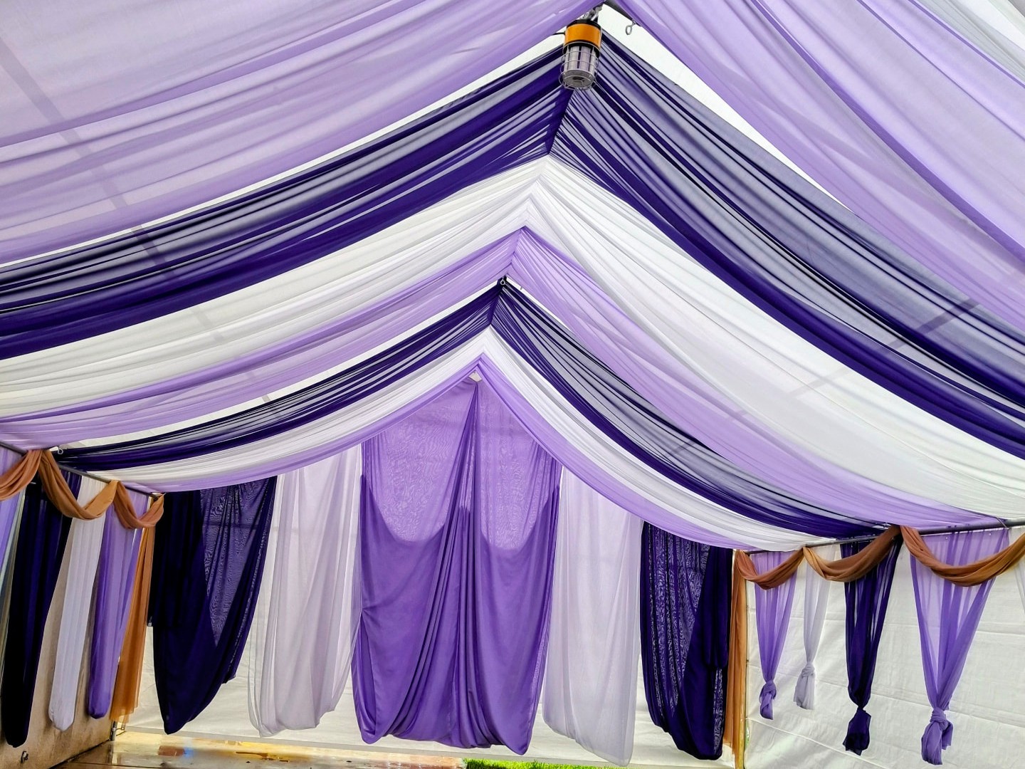 Purple and white draped canopy